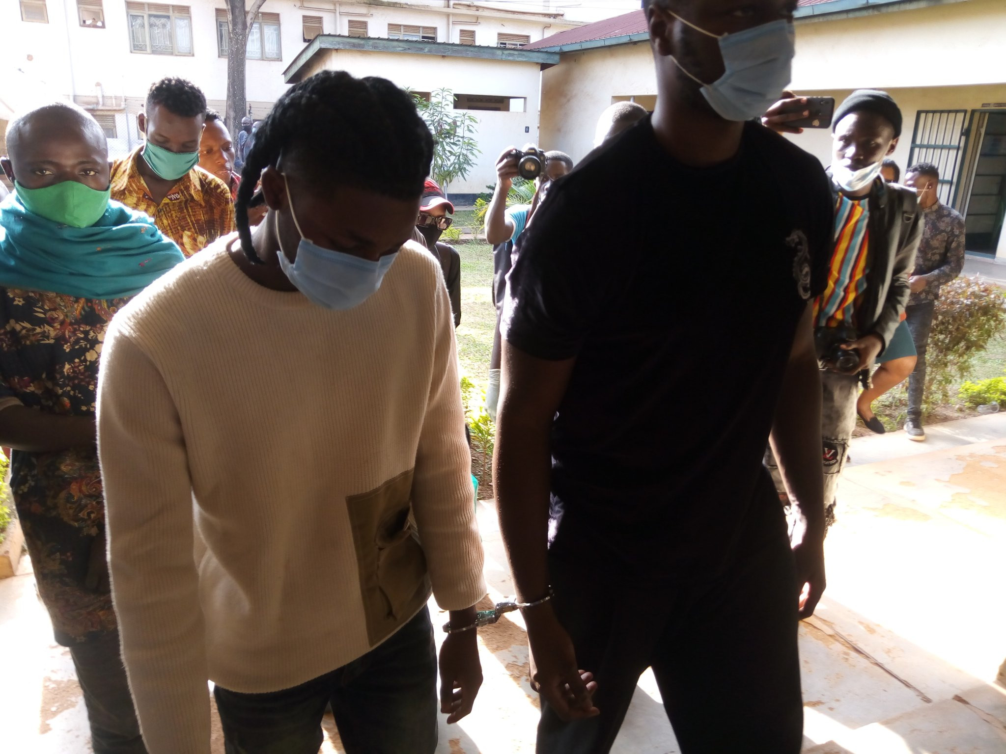 Photos of Omah Lay in handcuff and being taken to prison in Uganda lindaikejisblog 3